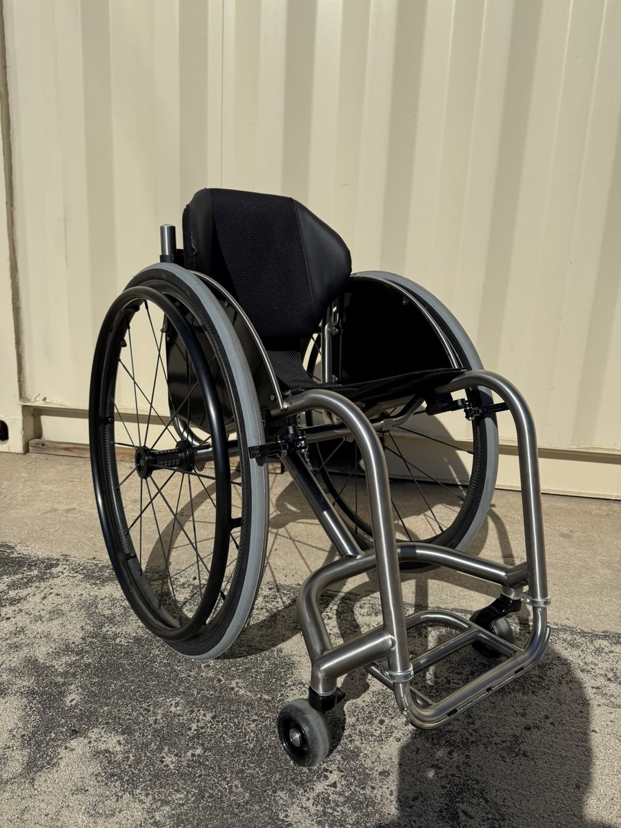 A custom HOC wheelchair configured around its rider.