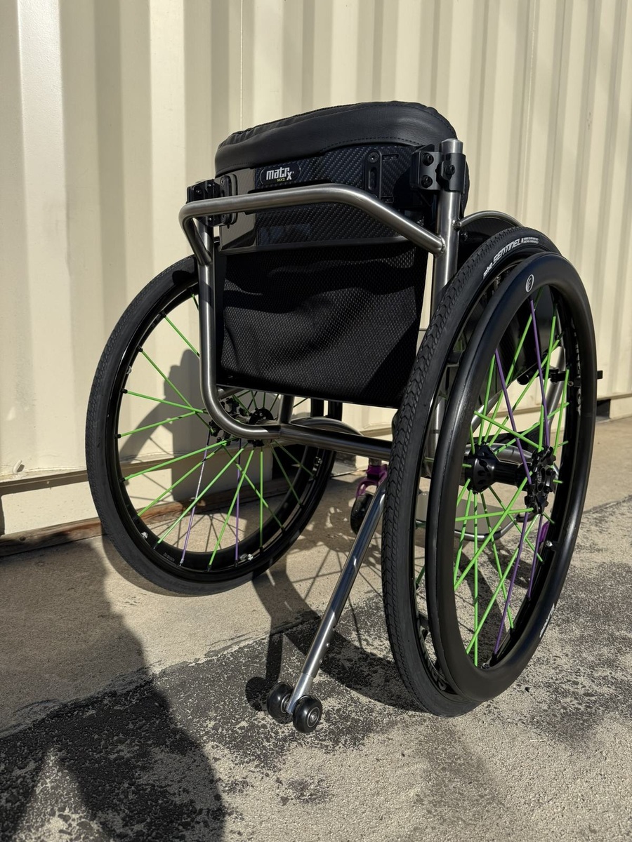 A custom HOC wheelchair configured around its rider.