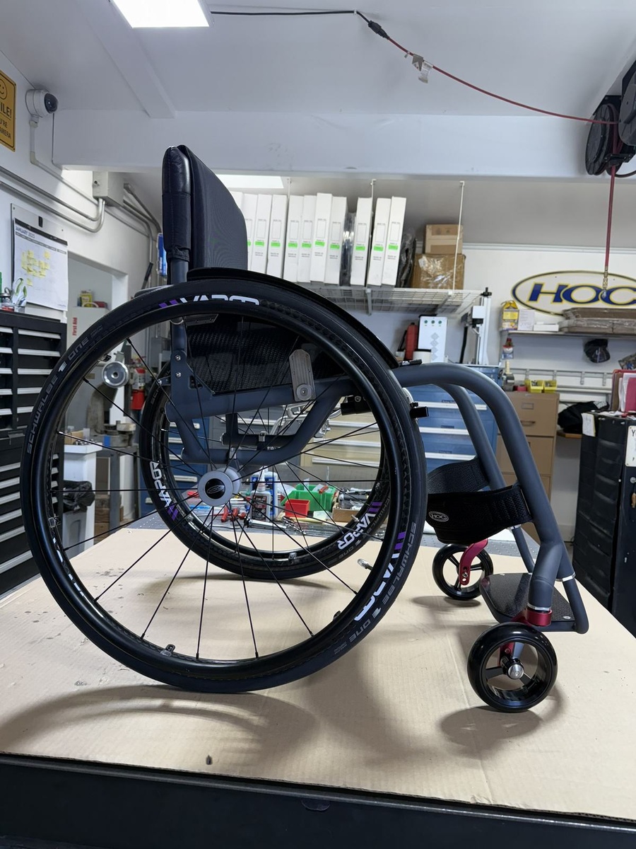 A custom HOC wheelchair configured around its rider.