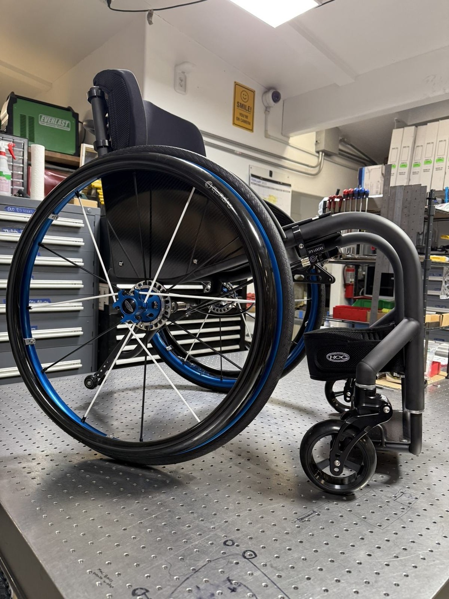 A custom HOC wheelchair configured around its rider.
