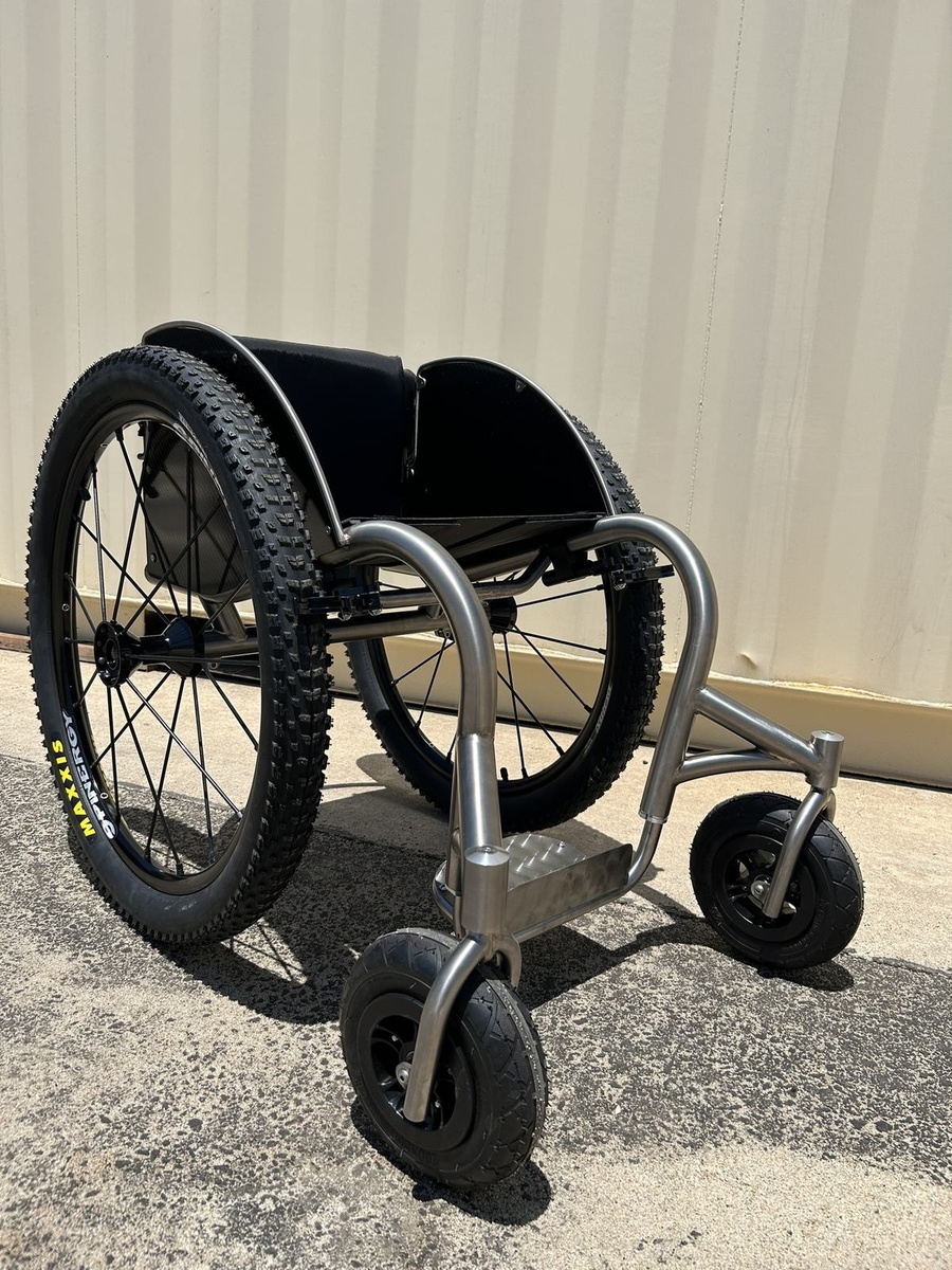 An HOC wheelchair configured for power assist or rough terrain.