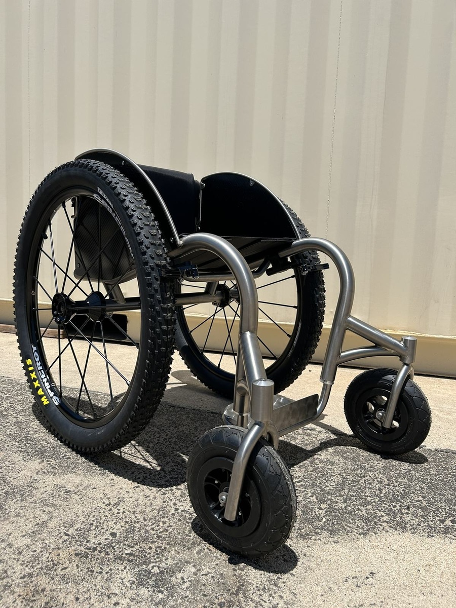 An HOC wheelchair configured for power assist or rough terrain.