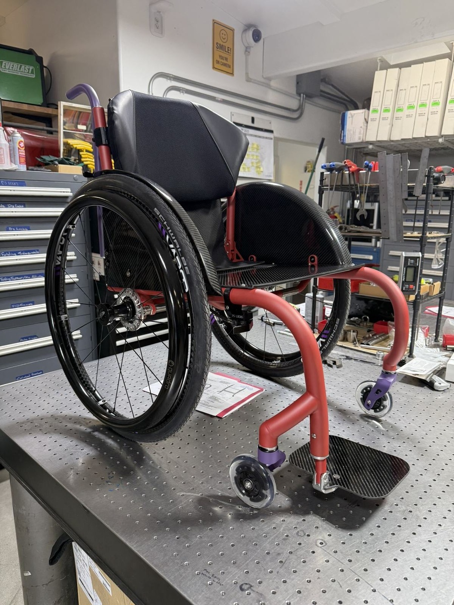 A custom HOC wheelchair configured around its rider.
