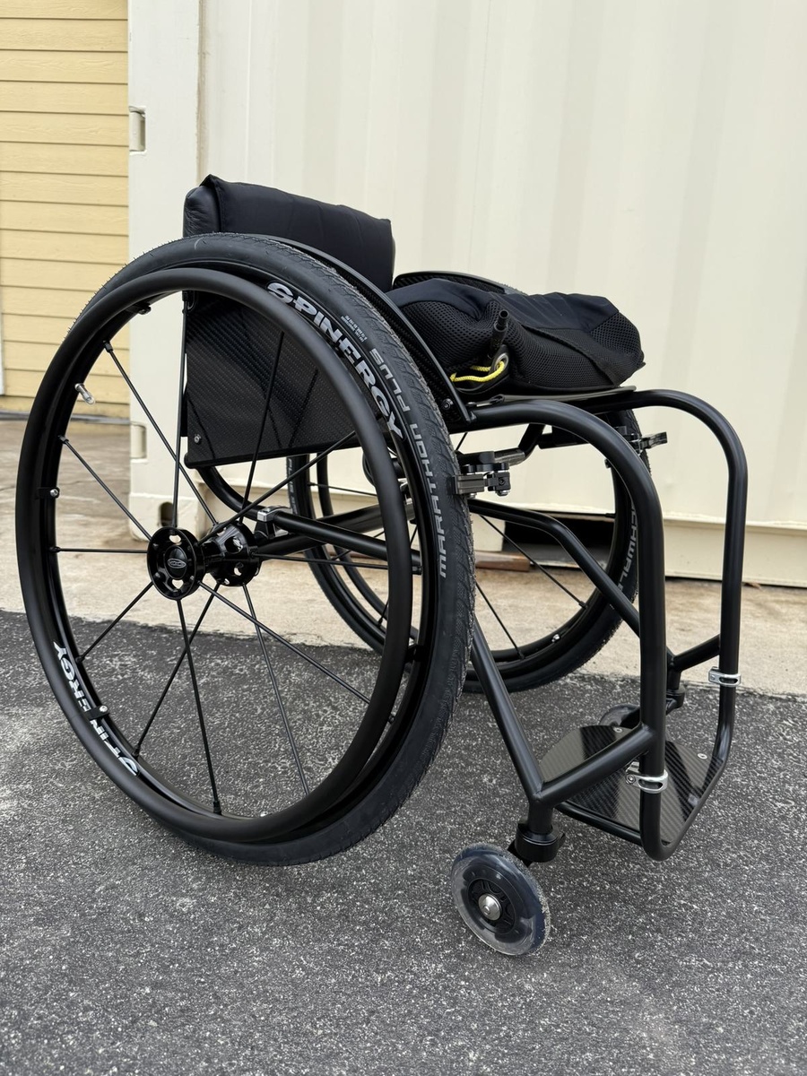 A custom HOC wheelchair configured around its rider.