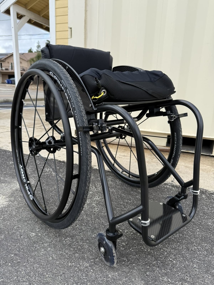 A custom HOC wheelchair configured around its rider.