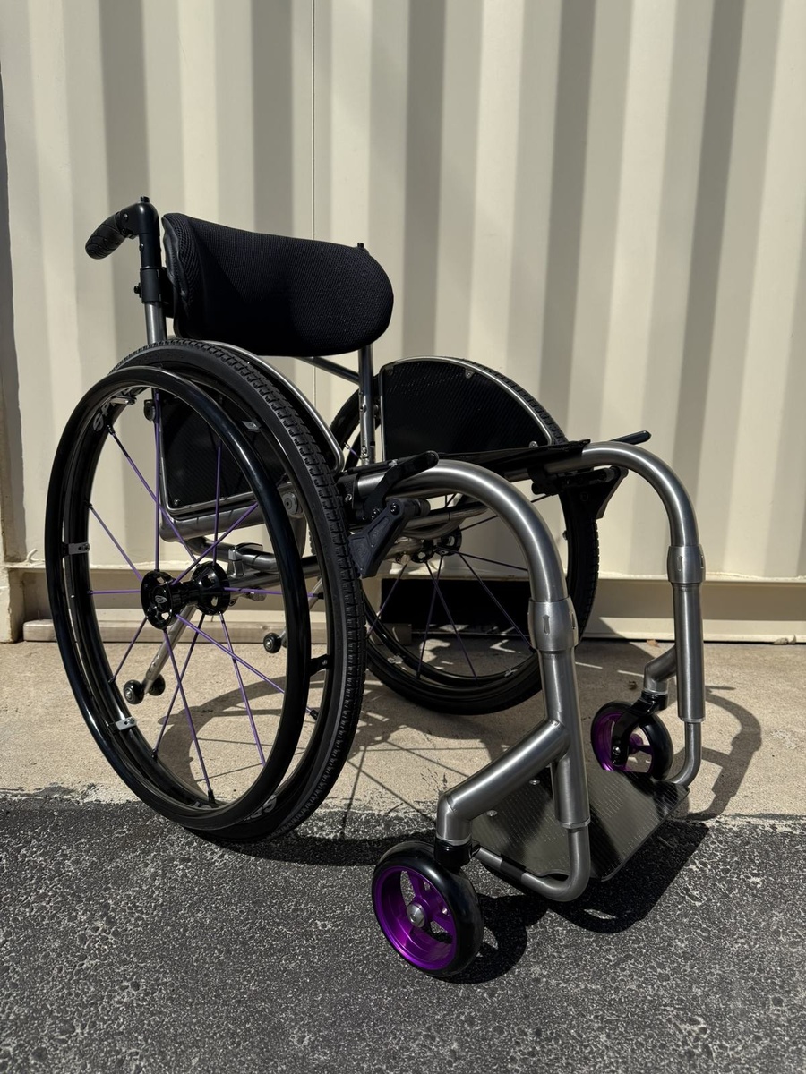 A custom HOC wheelchair configured around its rider.