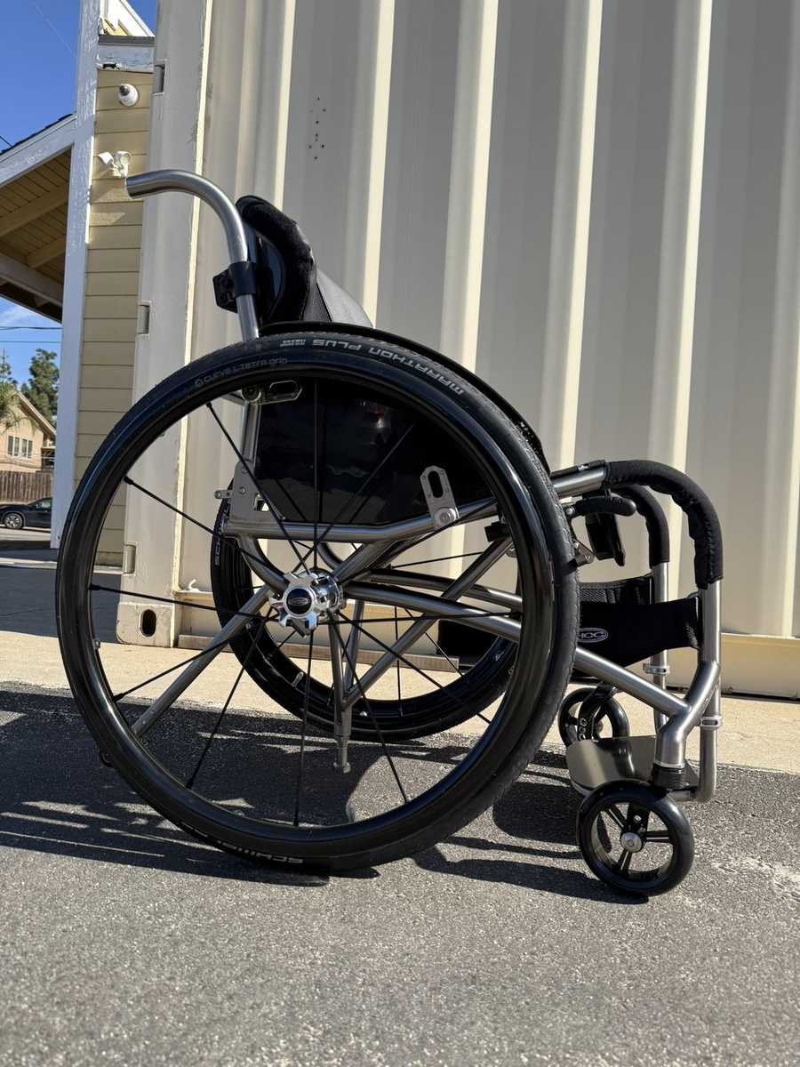 A custom HOC wheelchair configured around its rider.