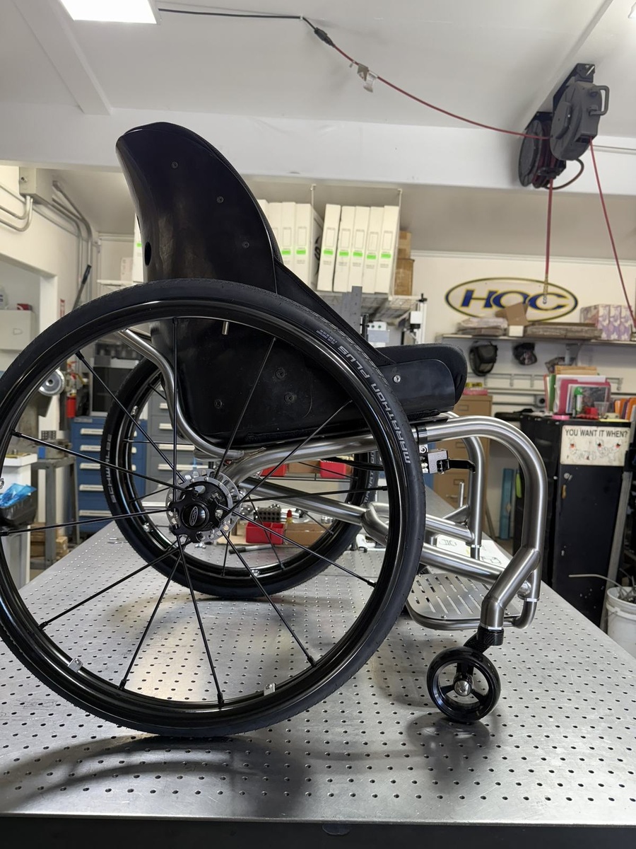 A custom HOC wheelchair configured around its rider.