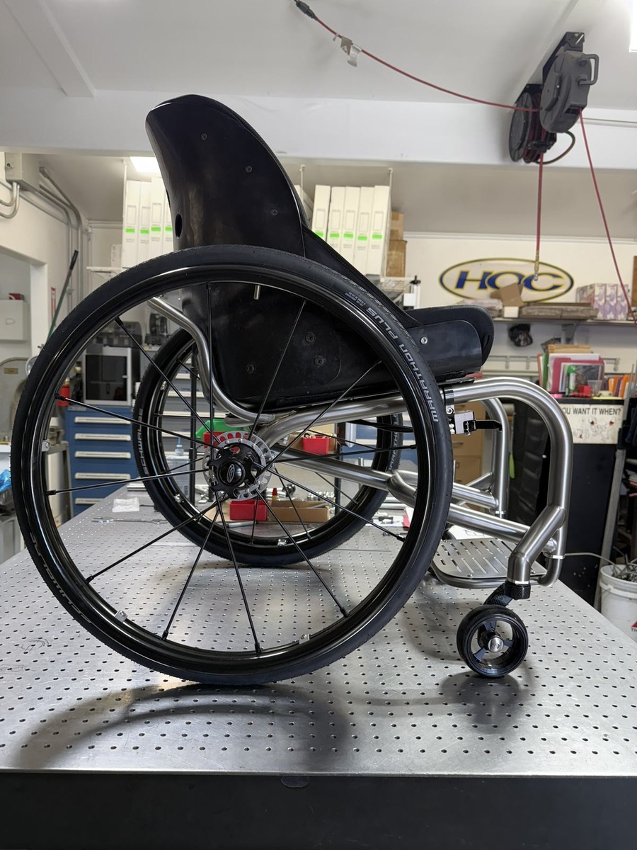 A custom HOC wheelchair configured around its rider.