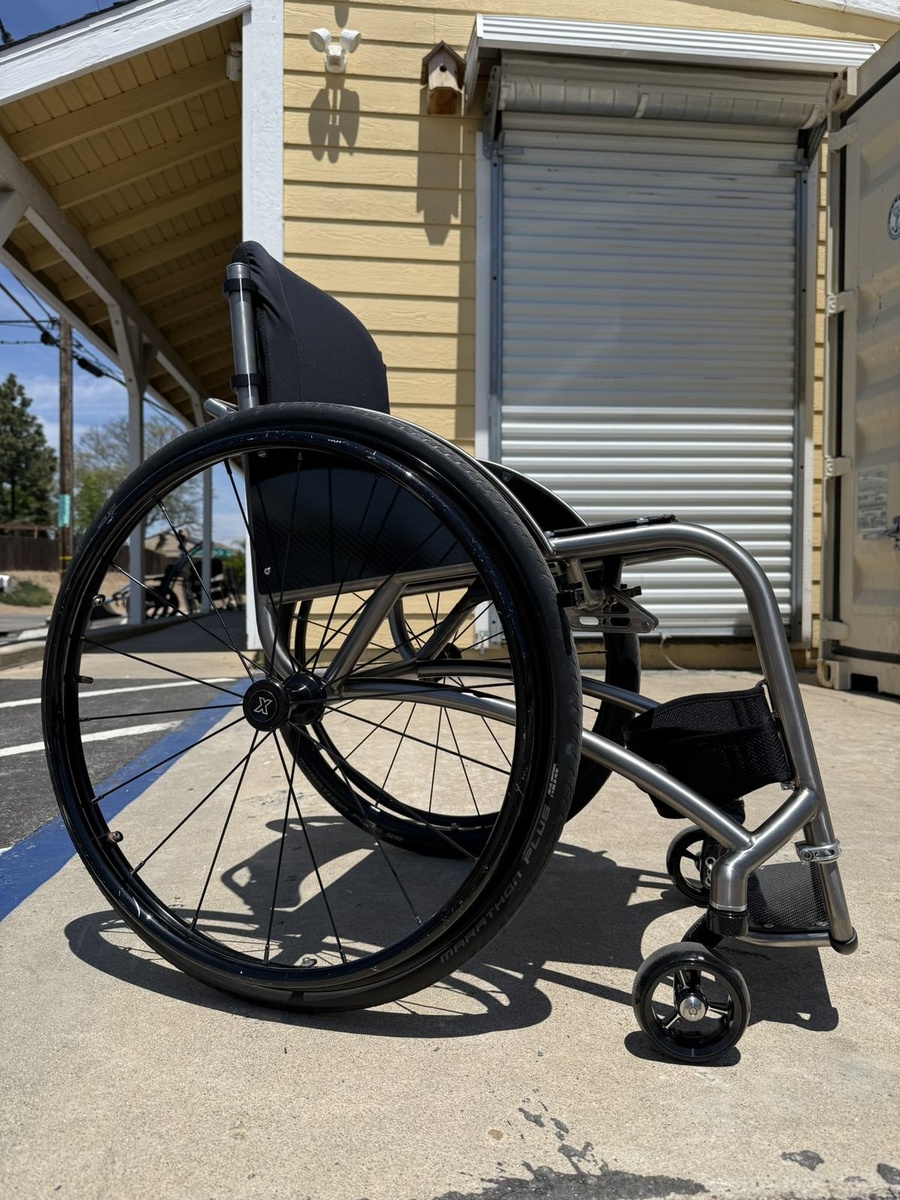 A custom HOC wheelchair configured around its rider.