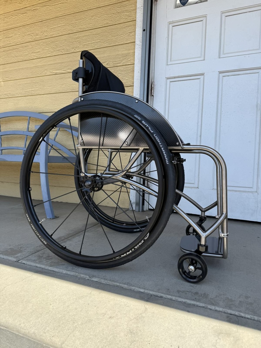 A custom HOC wheelchair configured around its rider.