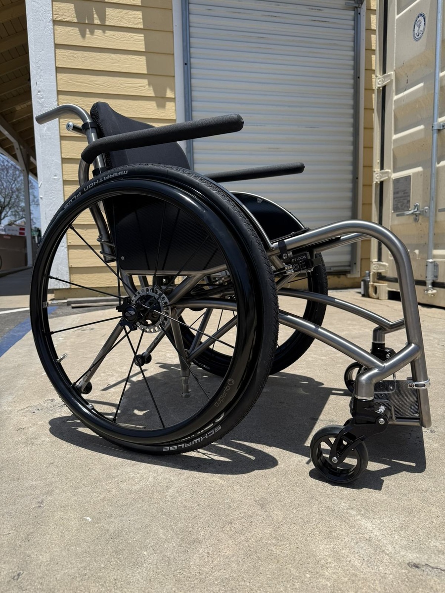 A custom HOC wheelchair configured around its rider.