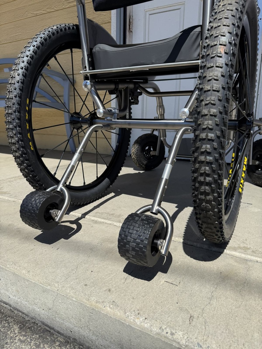 An HOC wheelchair configured for power assist or rough terrain.