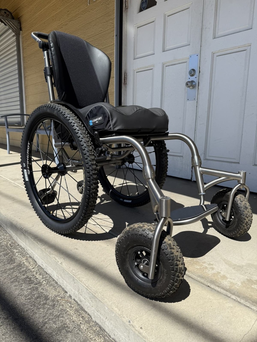 An HOC wheelchair configured for power assist or rough terrain.