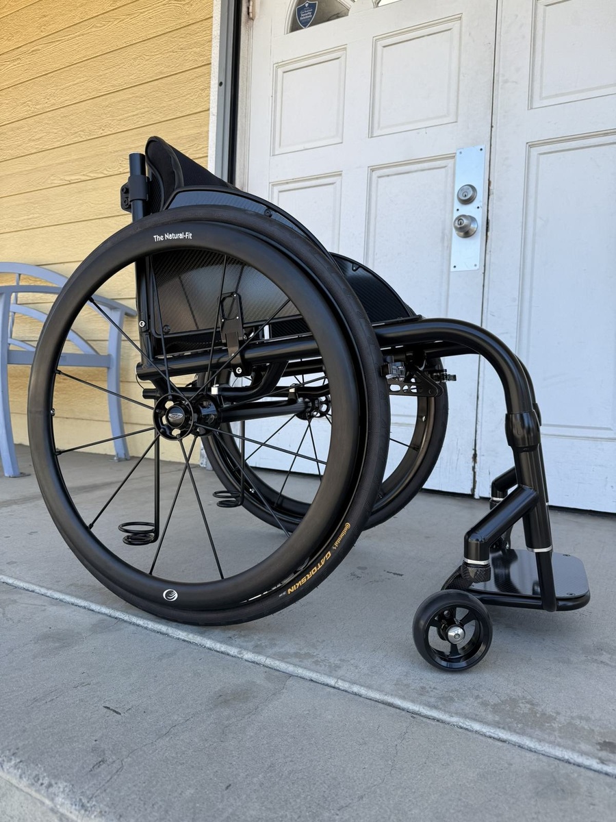 A custom HOC wheelchair configured around its rider.