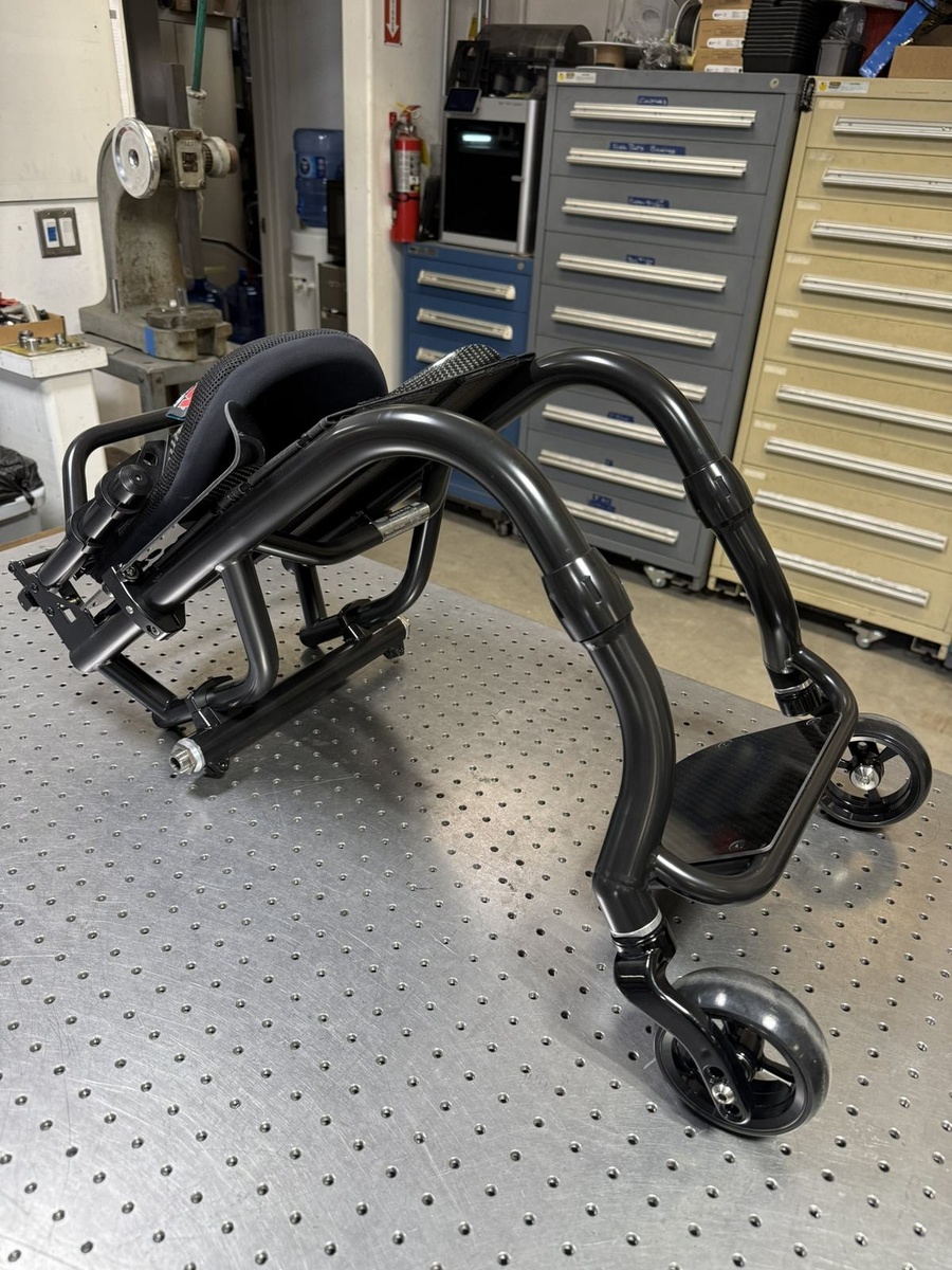 A custom HOC wheelchair configured around its rider.