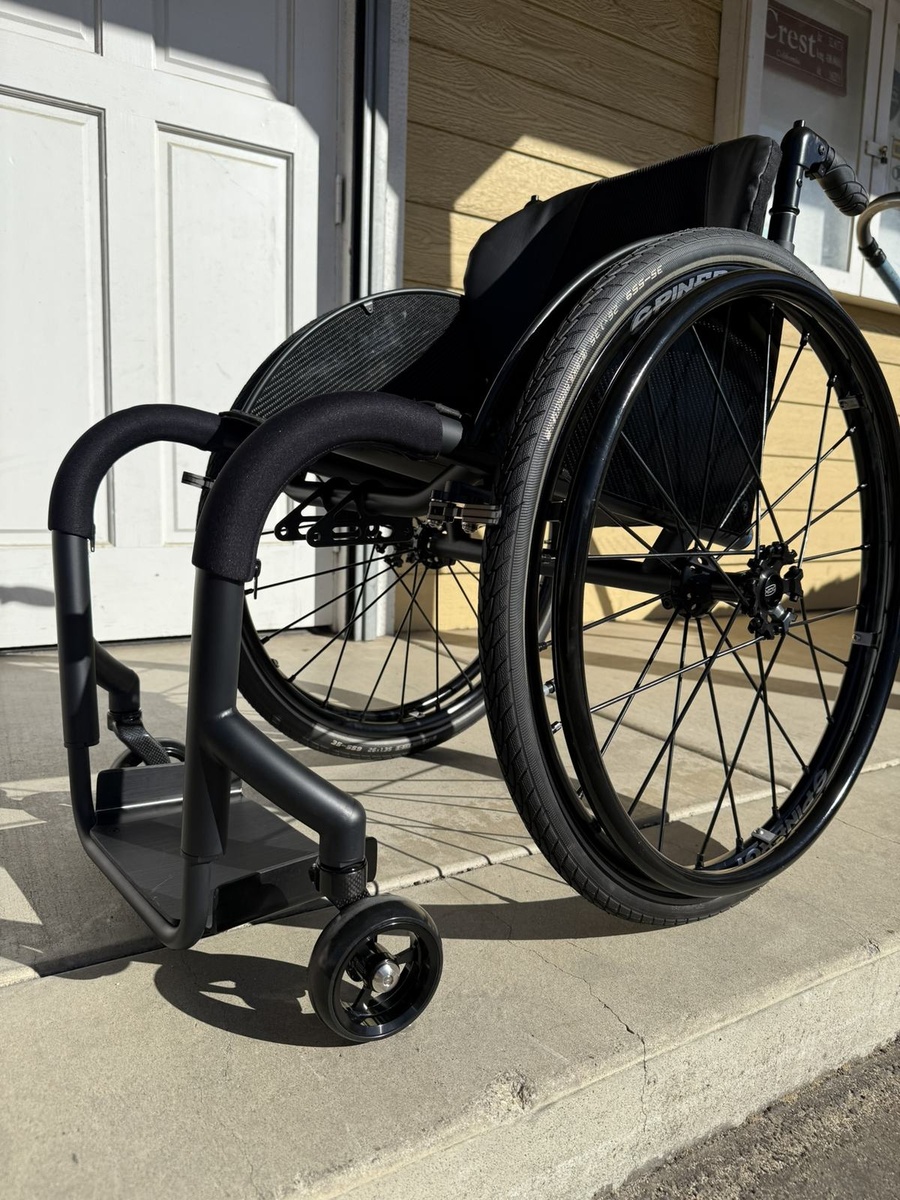 A custom HOC wheelchair configured around its rider.