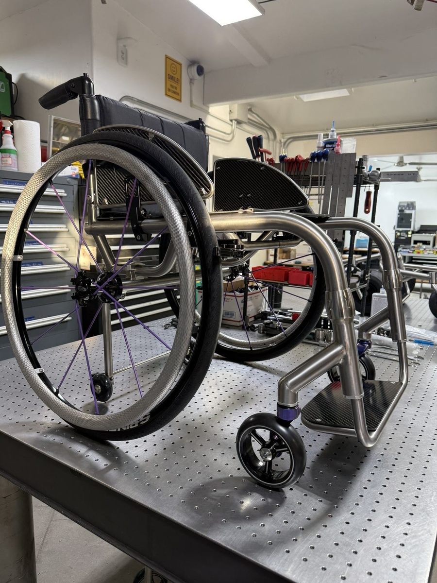 A custom HOC wheelchair configured around its rider.