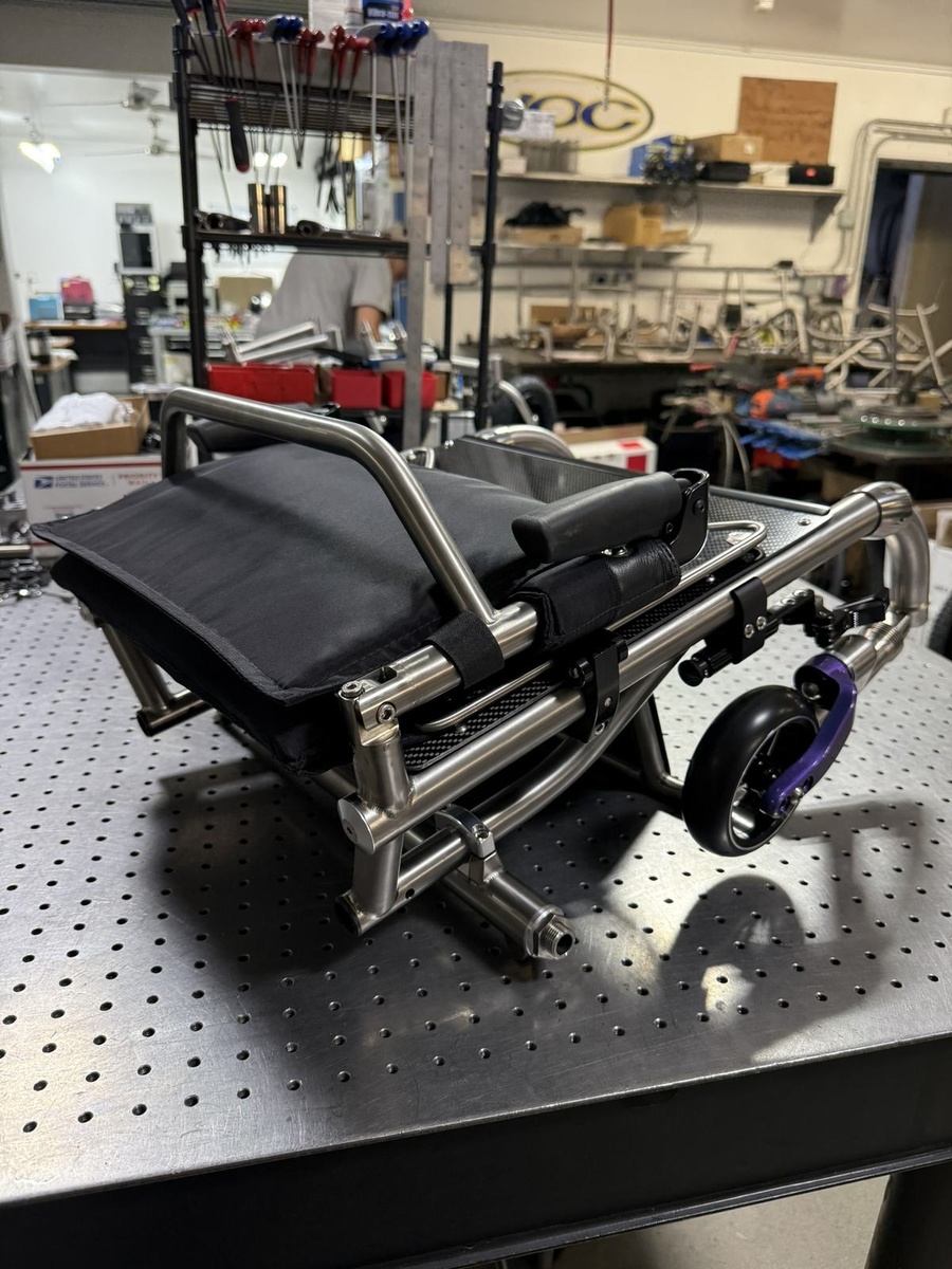 A travel-ready HOC wheelchair with folding or coupler features.
