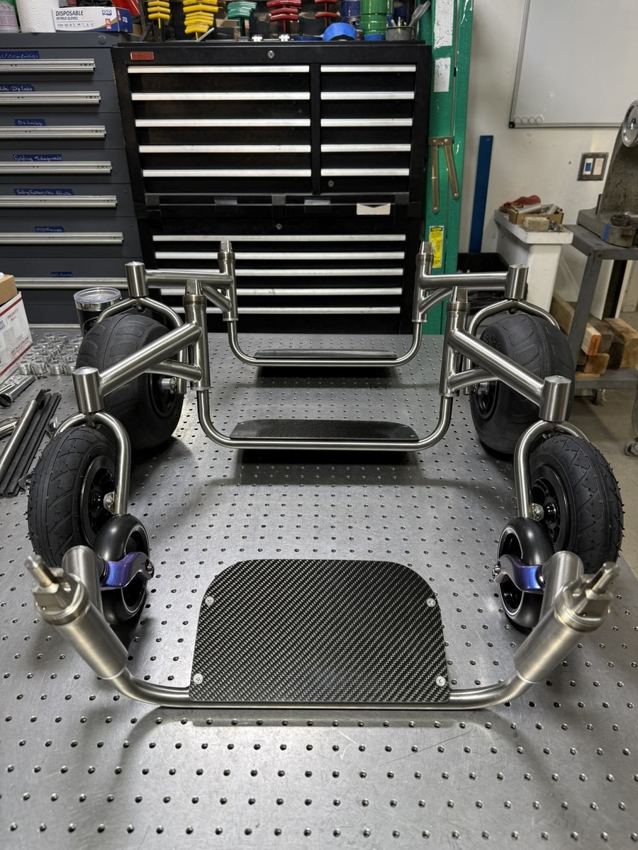 A travel-ready HOC wheelchair with folding or coupler features.