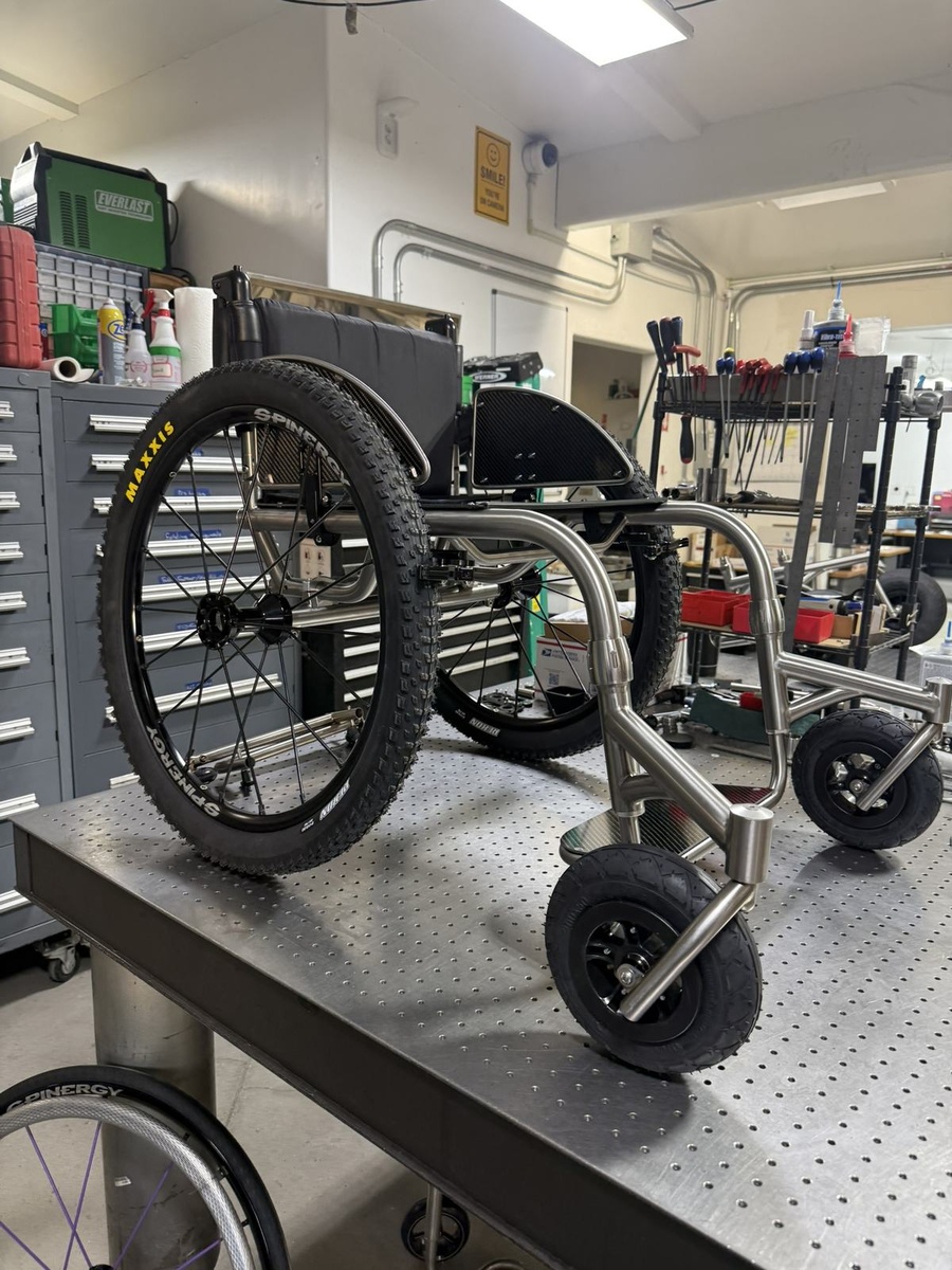 An HOC wheelchair configured for power assist or rough terrain.