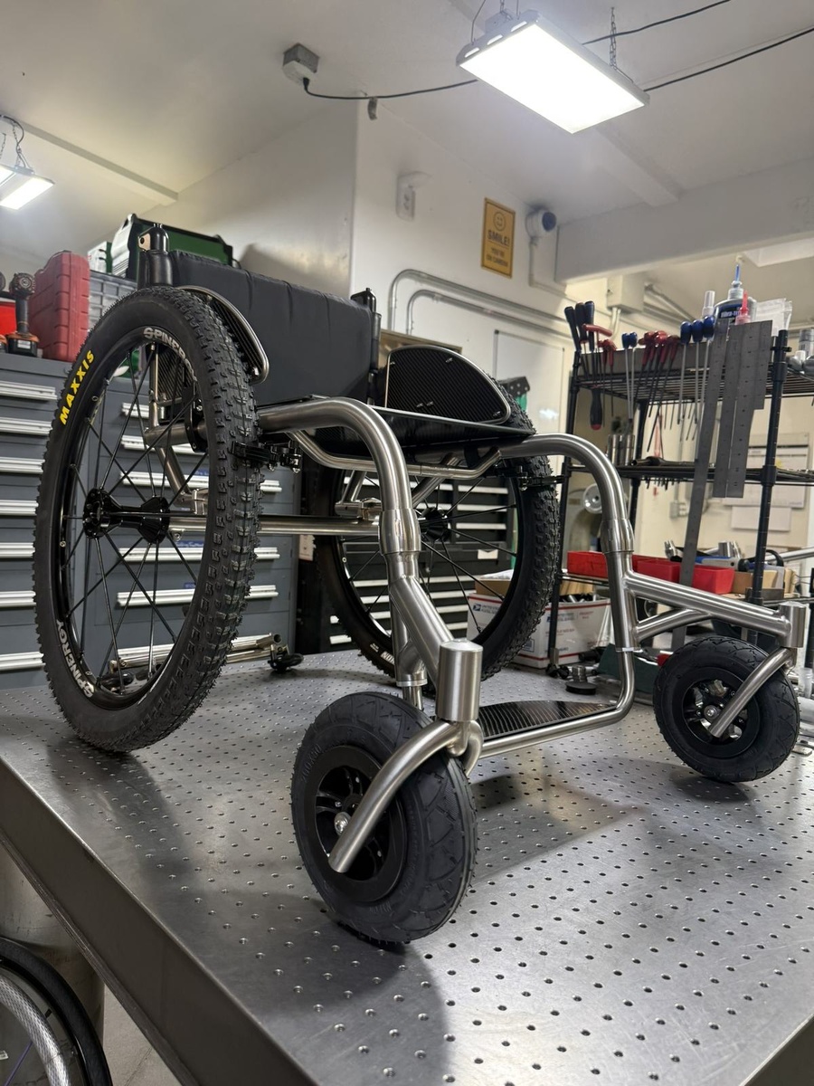 An HOC wheelchair configured for power assist or rough terrain.