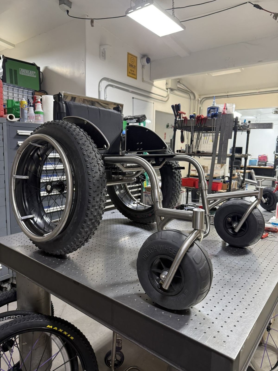 An HOC wheelchair configured for power assist or rough terrain.