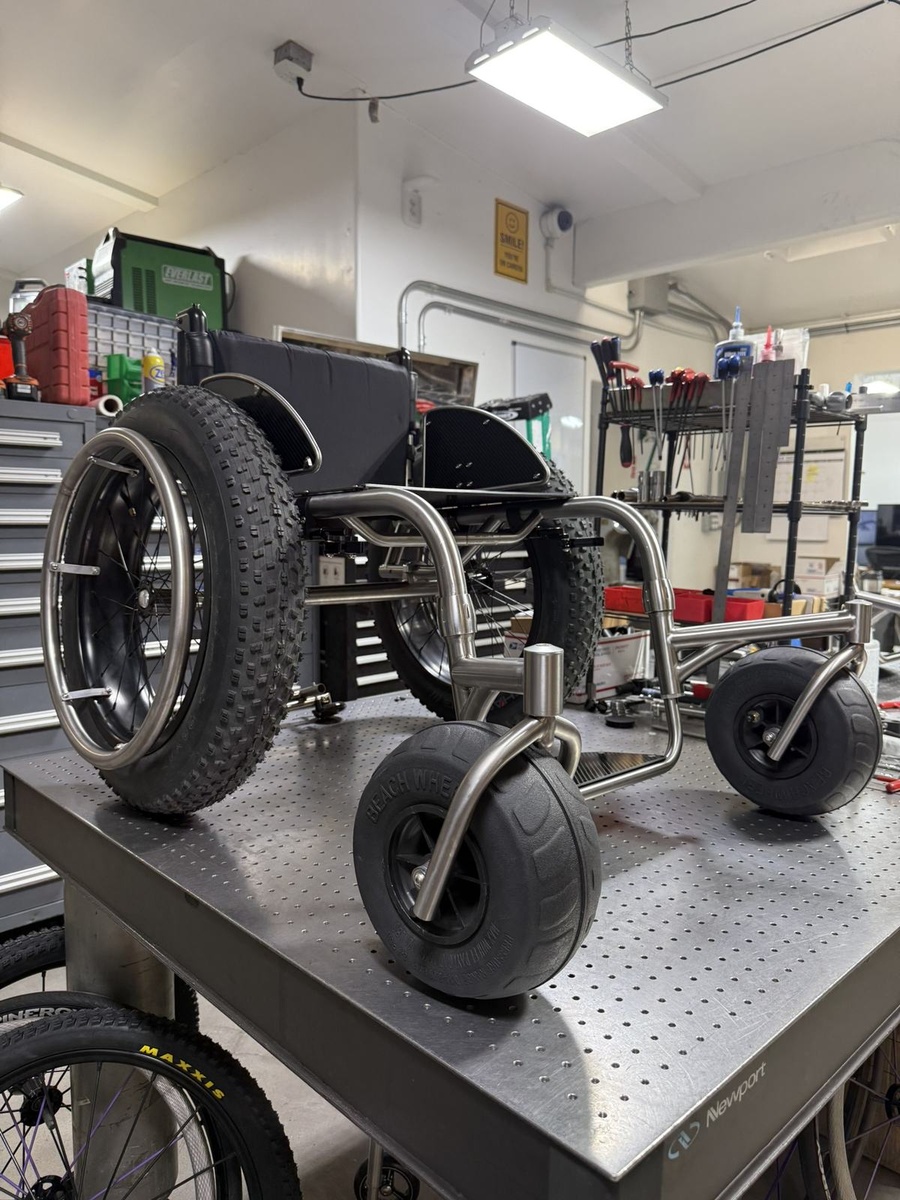 An HOC wheelchair configured for power assist or rough terrain.