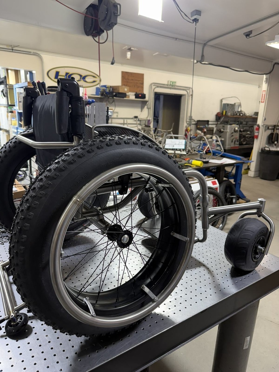 An HOC wheelchair configured for power assist or rough terrain.