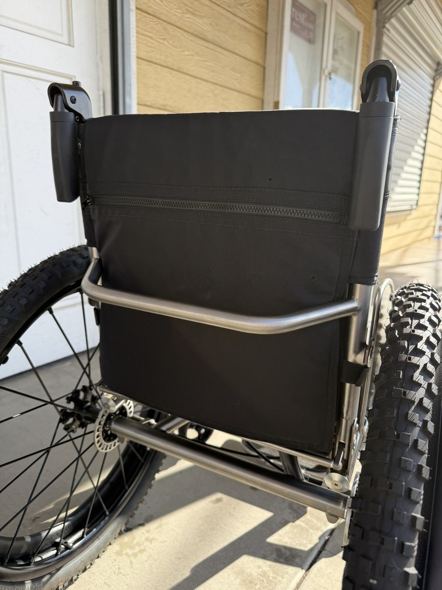 An HOC wheelchair configured for power assist or rough terrain.