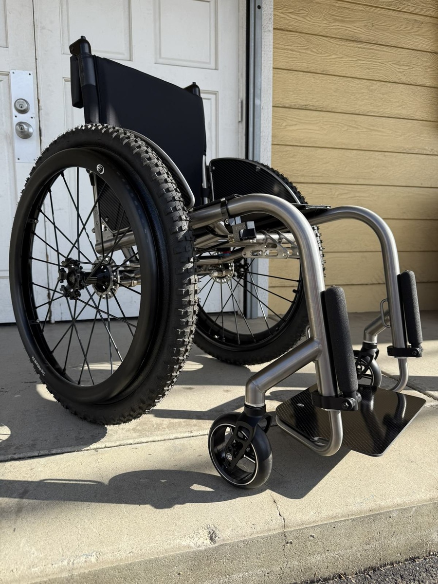 An HOC wheelchair configured for power assist or rough terrain.