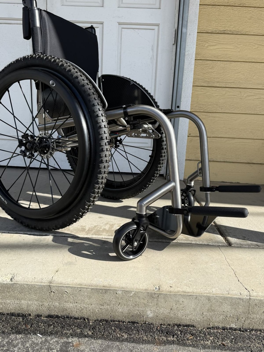 An HOC wheelchair configured for power assist or rough terrain.