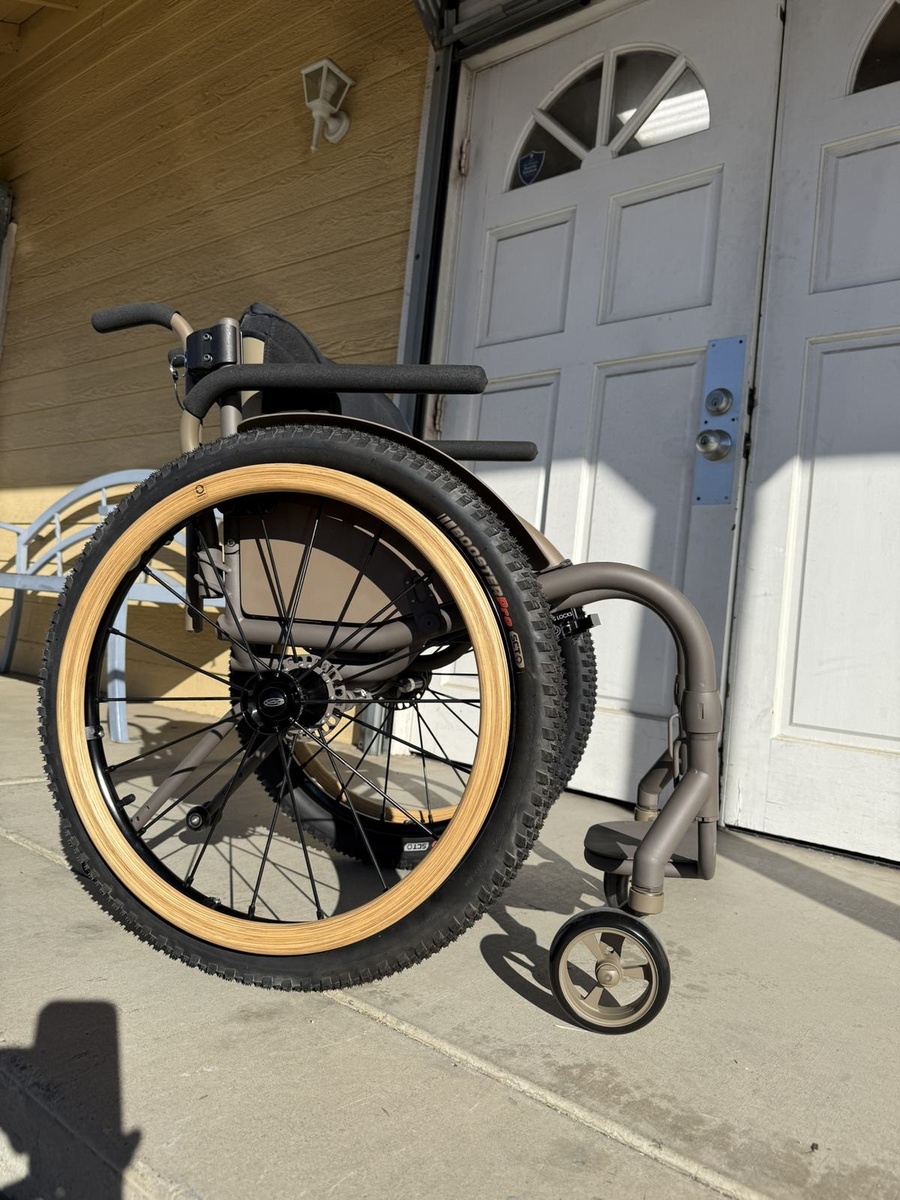 An HOC wheelchair configured for power assist or rough terrain.