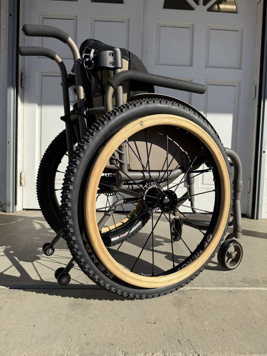 An HOC wheelchair configured for power assist or rough terrain.