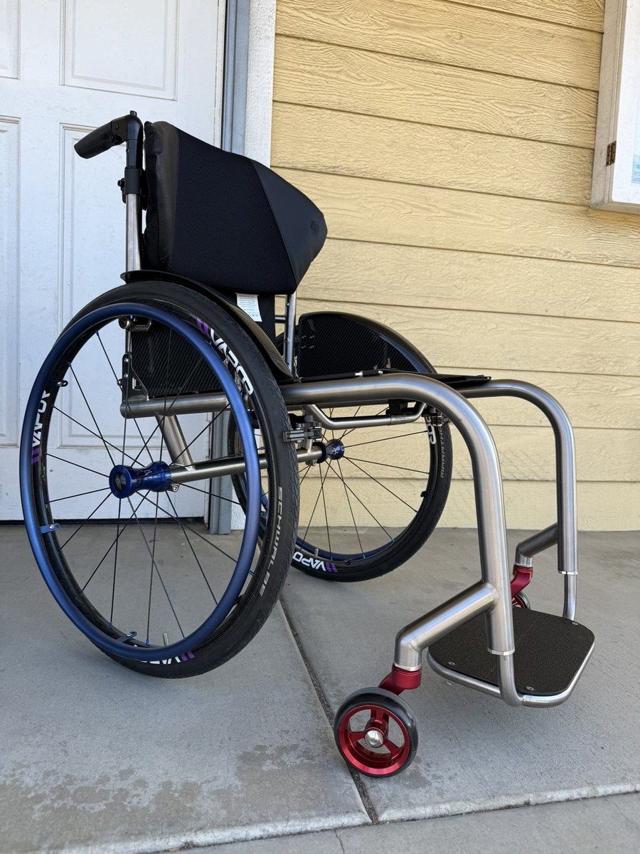 A custom HOC wheelchair configured around its rider.