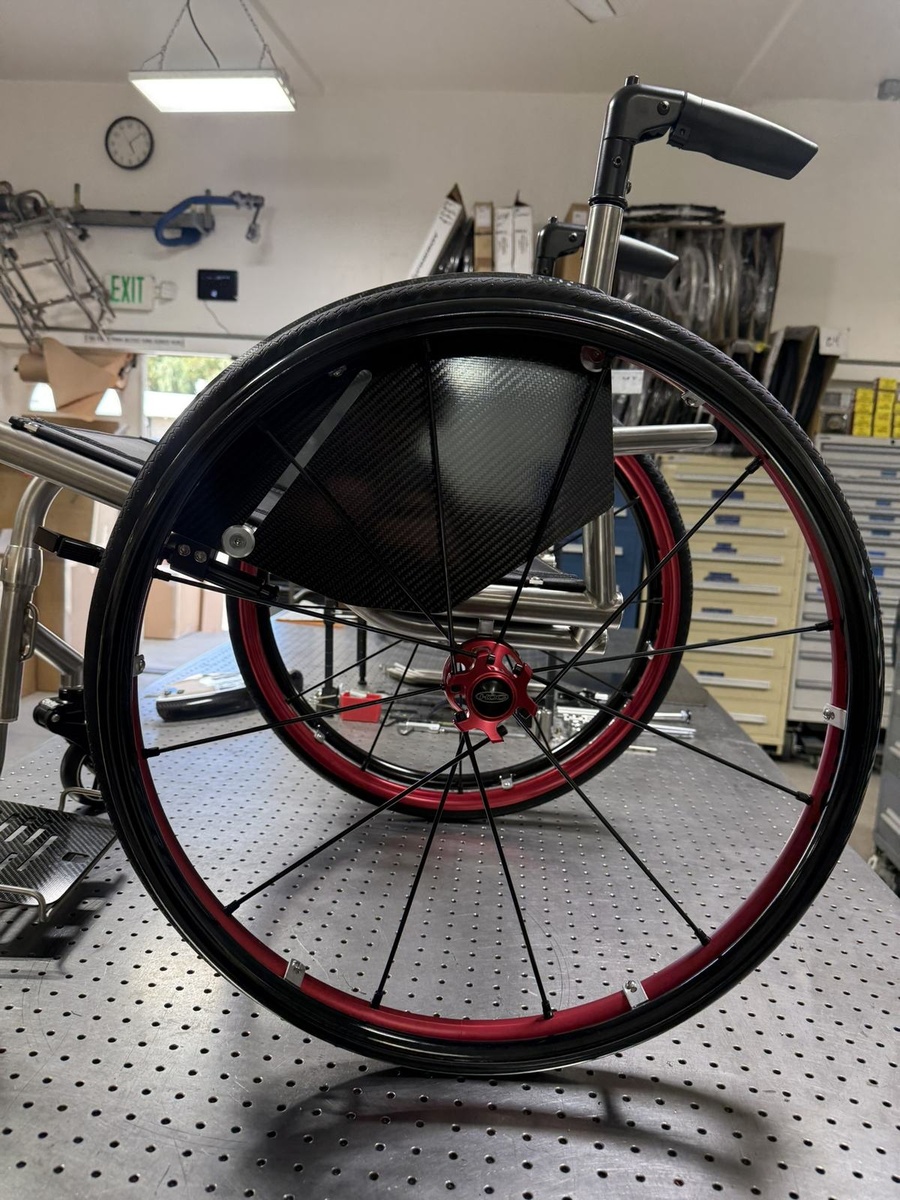 A custom HOC wheelchair configured around its rider.