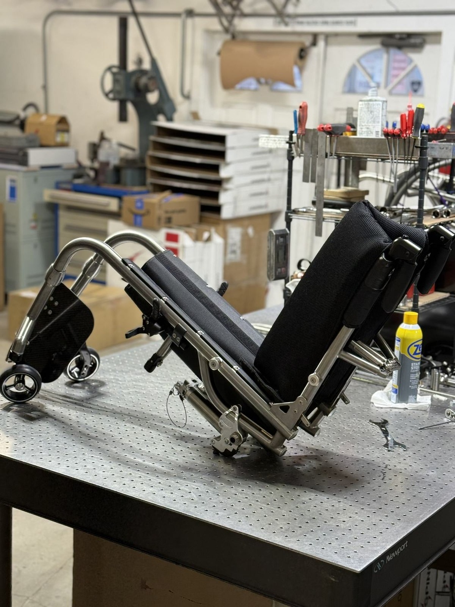 A travel-ready HOC wheelchair with folding or coupler features.