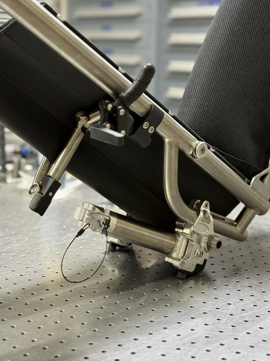 A travel-ready HOC wheelchair with folding or coupler features.