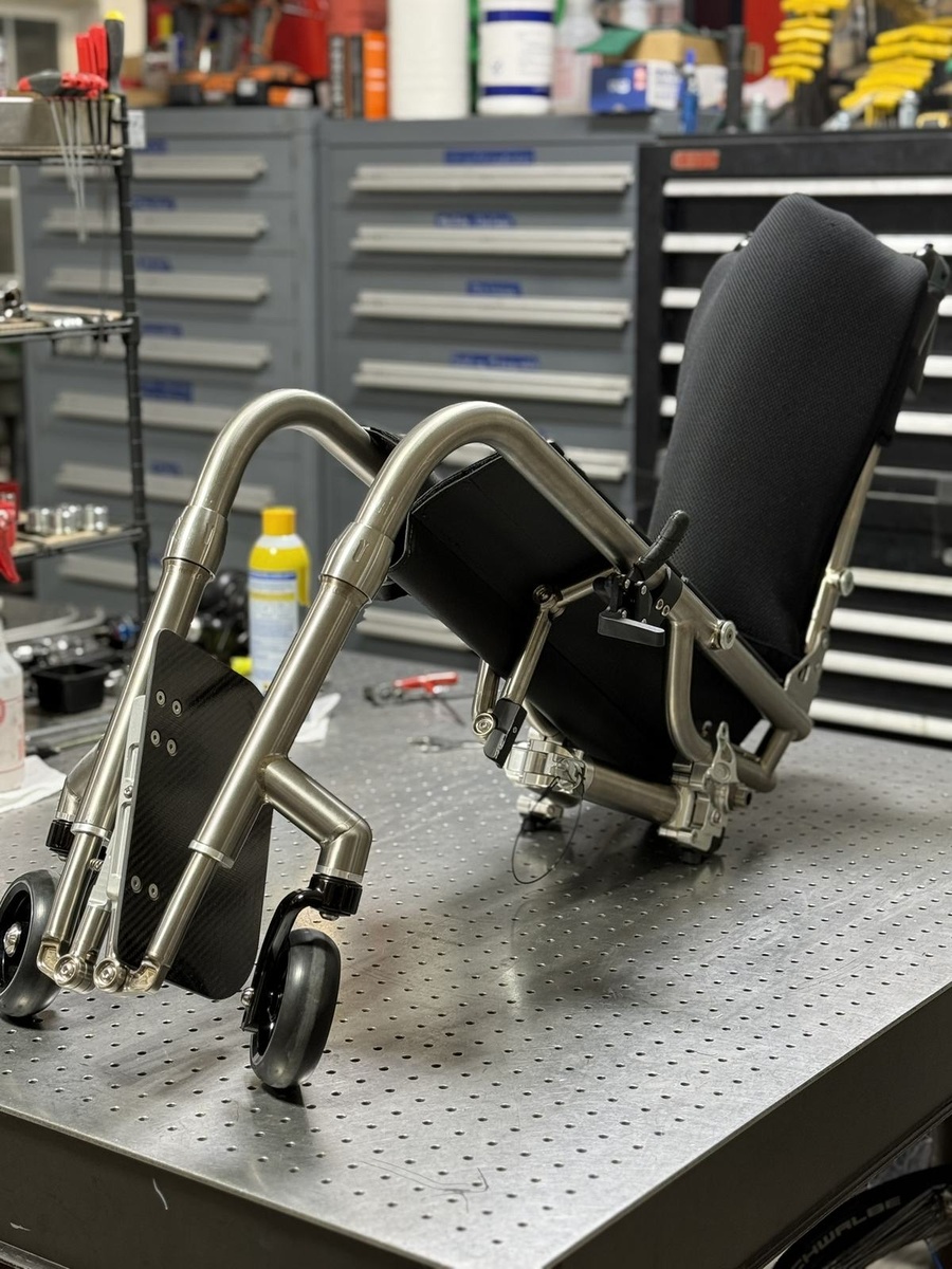 A travel-ready HOC wheelchair with folding or coupler features.