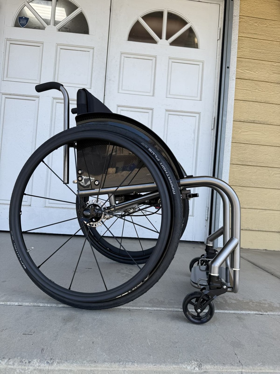 A custom HOC wheelchair configured around its rider.