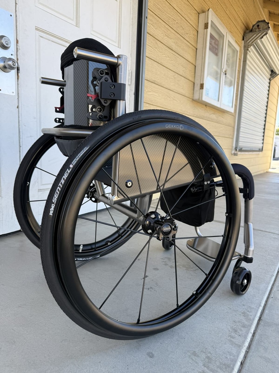 A custom HOC wheelchair configured around its rider.
