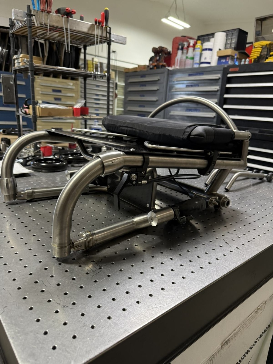 A travel-ready HOC wheelchair with folding or coupler features.