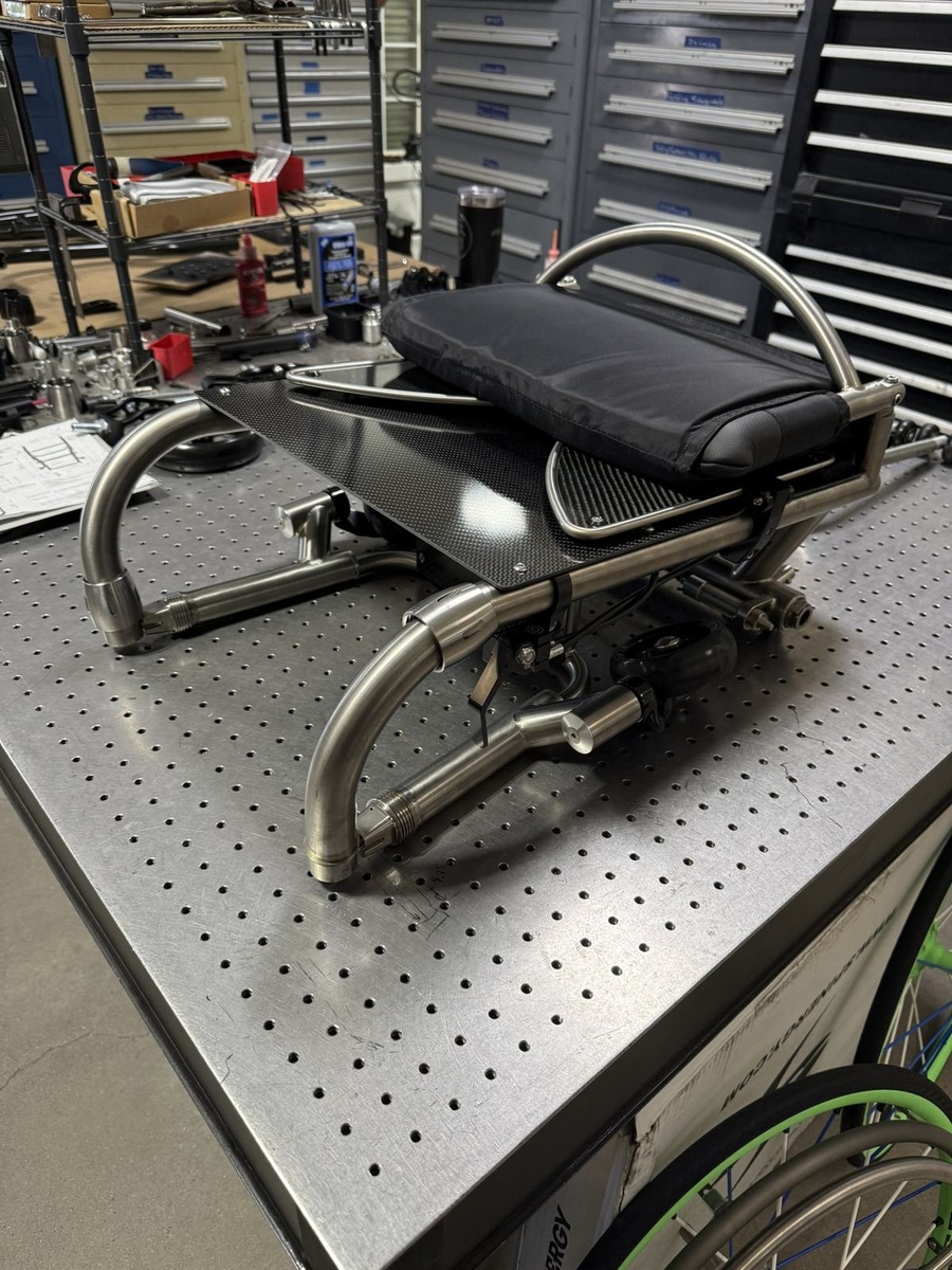 A travel-ready HOC wheelchair with folding or coupler features.