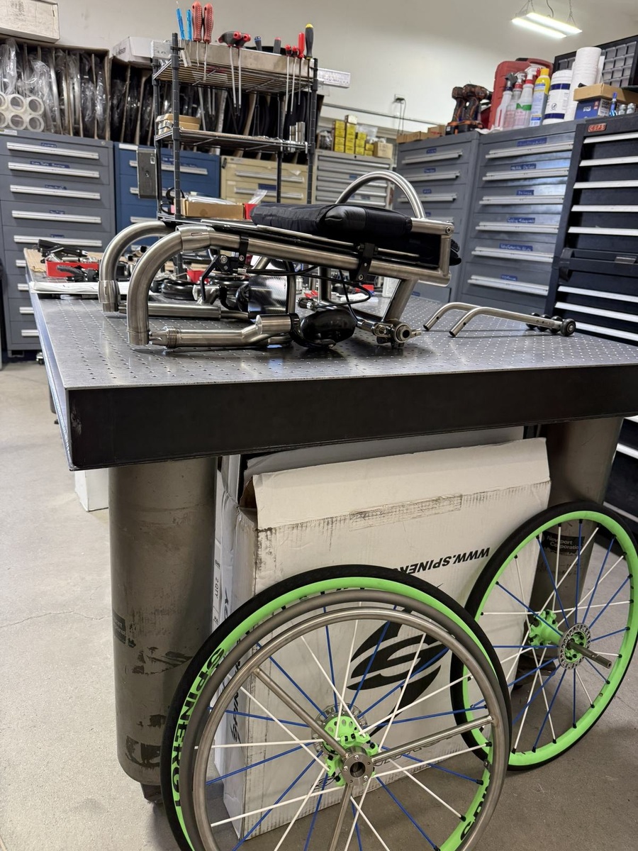 A travel-ready HOC wheelchair with folding or coupler features.