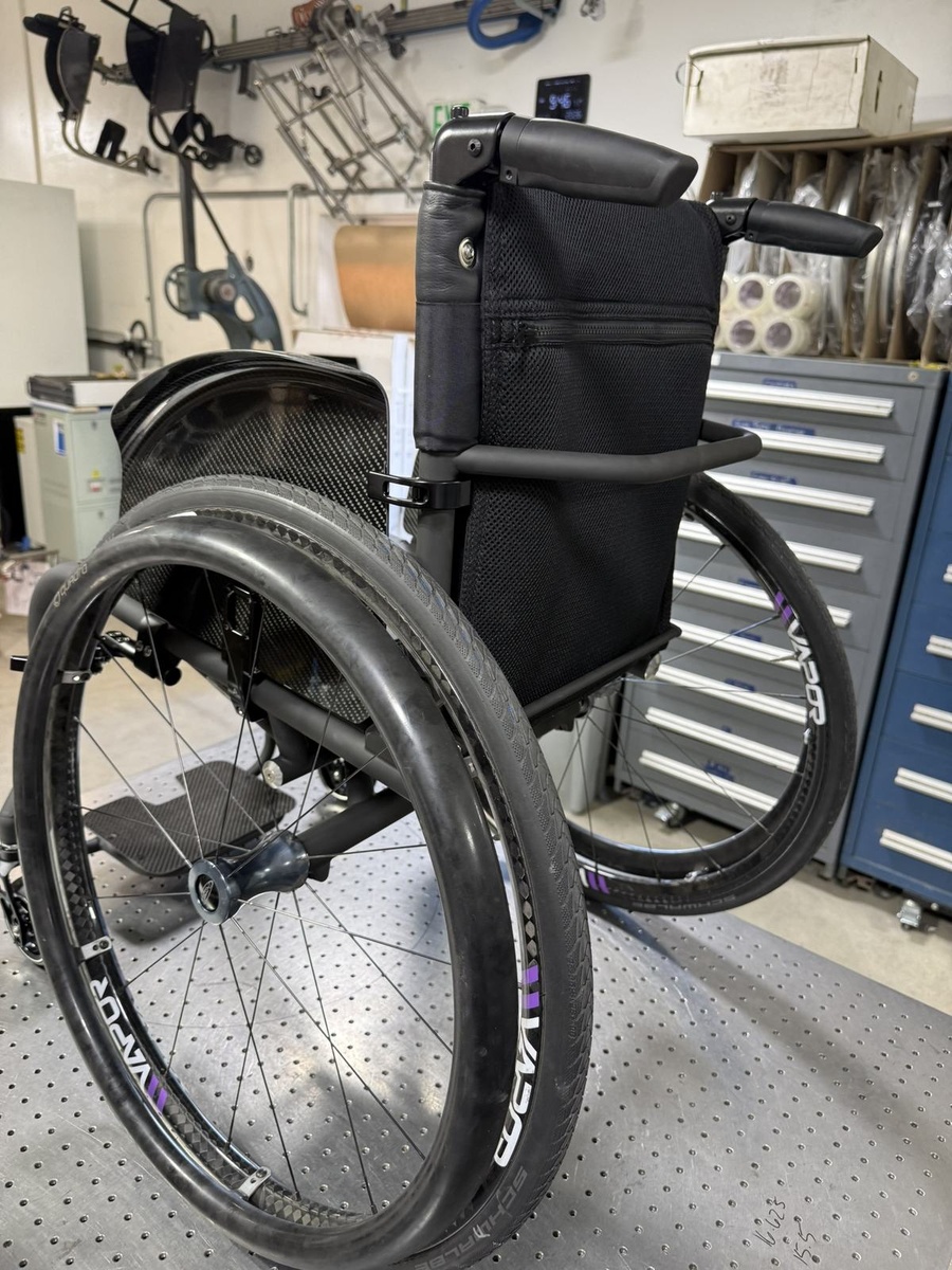A custom HOC wheelchair configured around its rider.