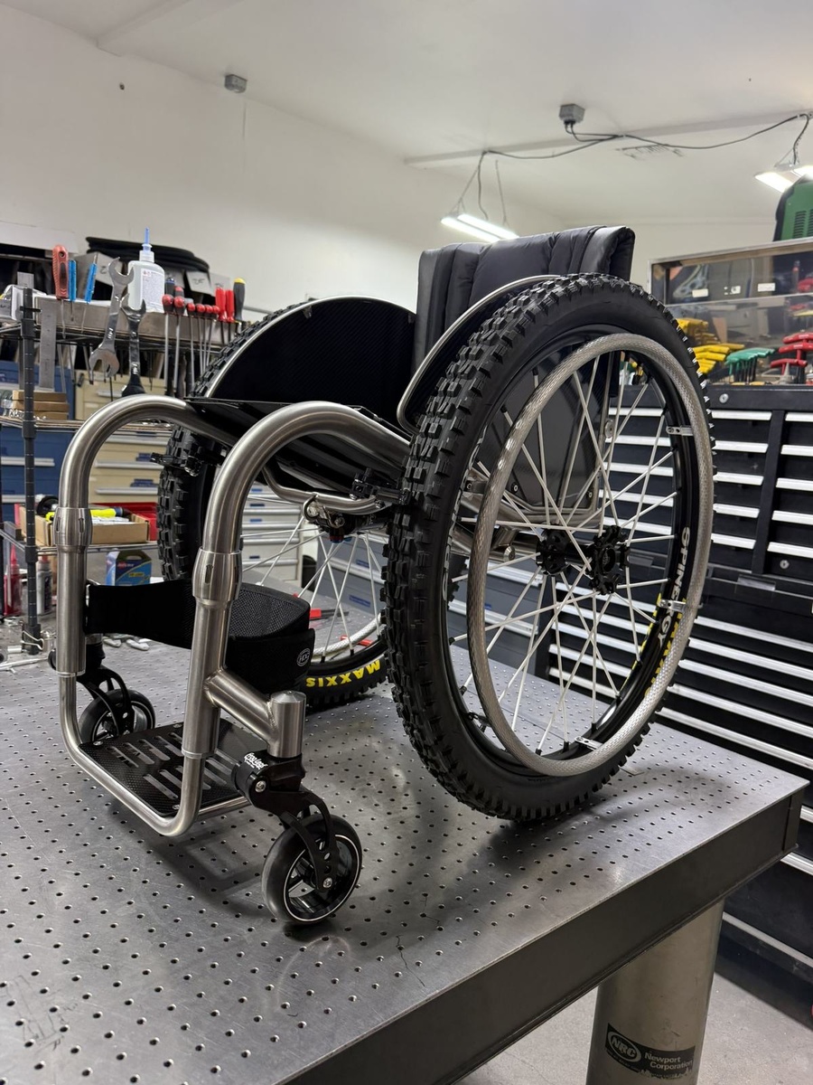 An HOC wheelchair configured for power assist or rough terrain.