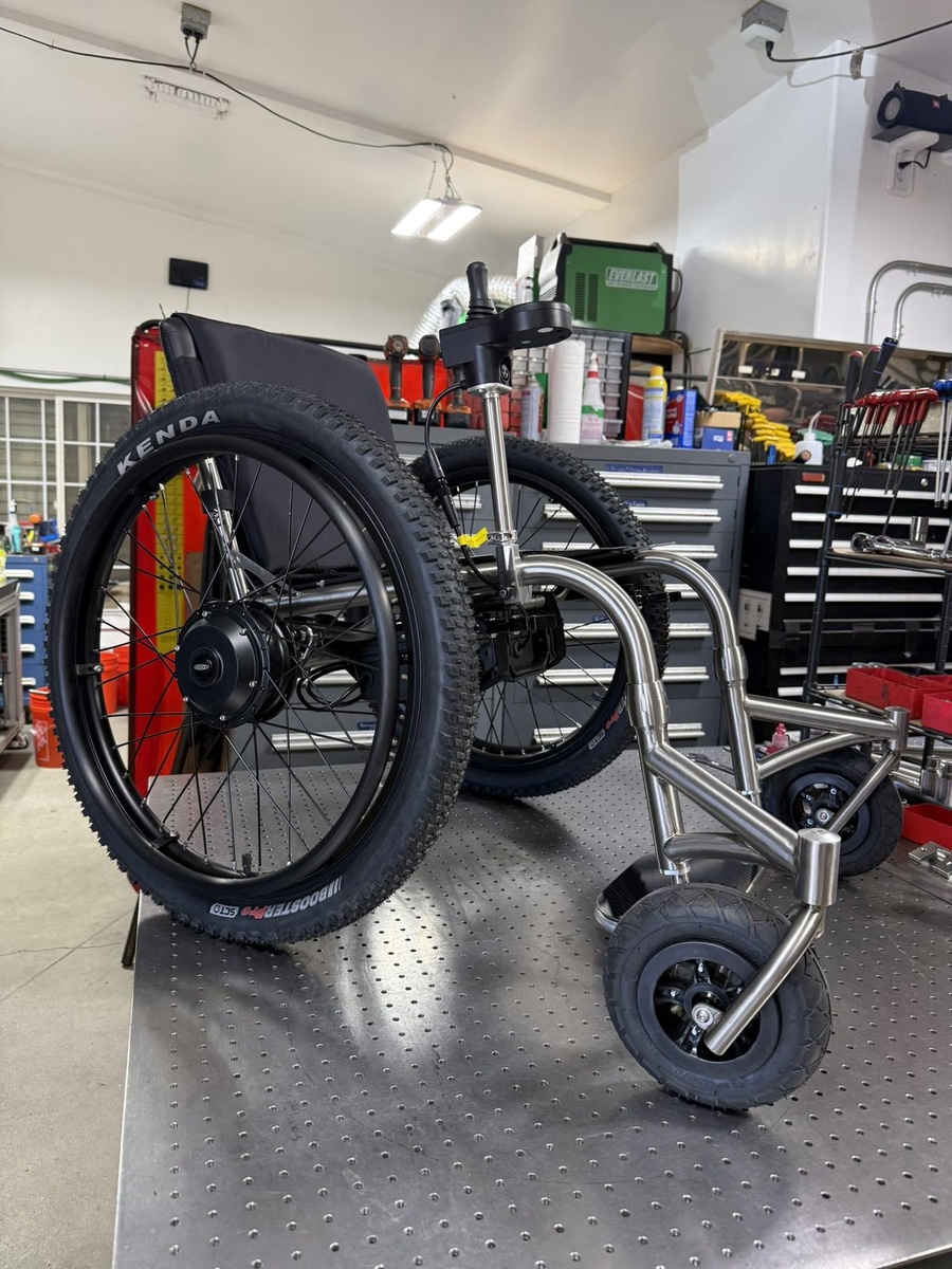 An HOC wheelchair configured for power assist or rough terrain.