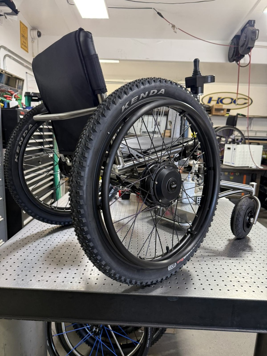 An HOC wheelchair configured for power assist or rough terrain.
