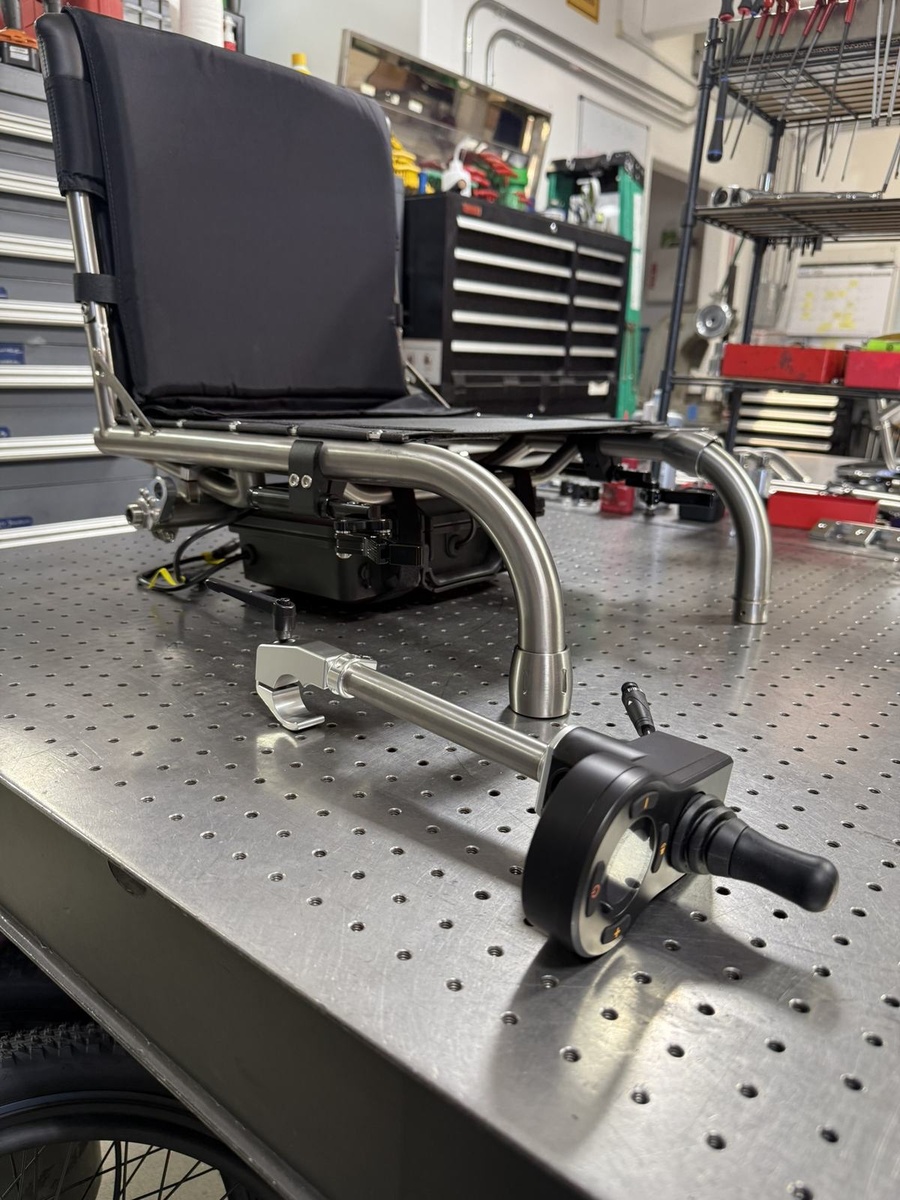 An HOC wheelchair configured for power assist or rough terrain.