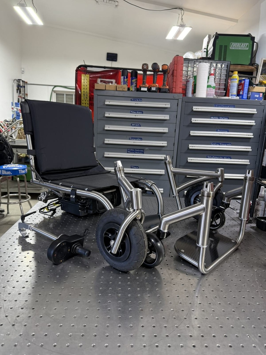 An HOC wheelchair configured for power assist or rough terrain.